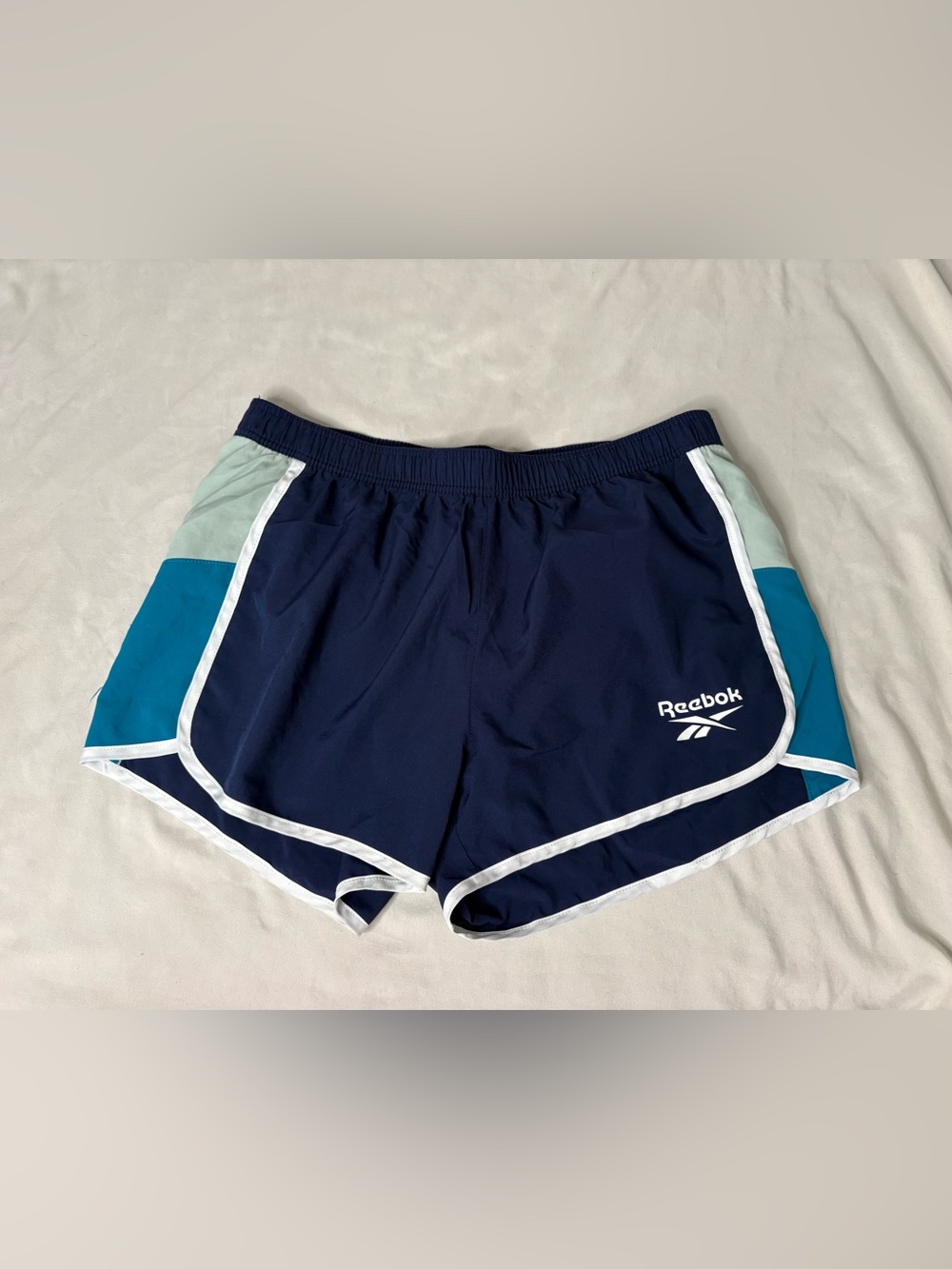 Reebok Women's Navy Athletic Shorts with White Trim and Light Blue Panels
